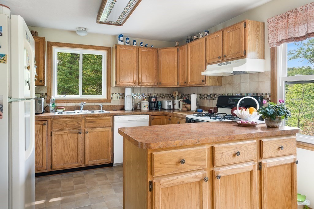32 Middle Road Southampton, MA 01073 - Photo 14 of 39 a kitchen with appliances cabinets a sink and a window