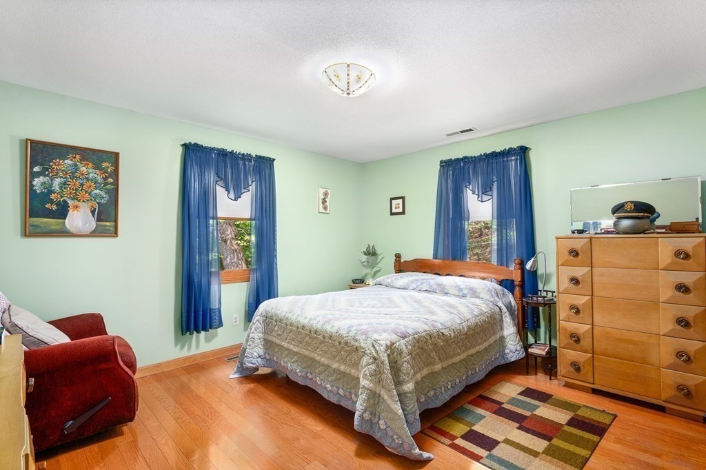 32 Middle Road Southampton, MA 01073 - Photo 19 of 39 a bedroom with a bed and a dresser in it