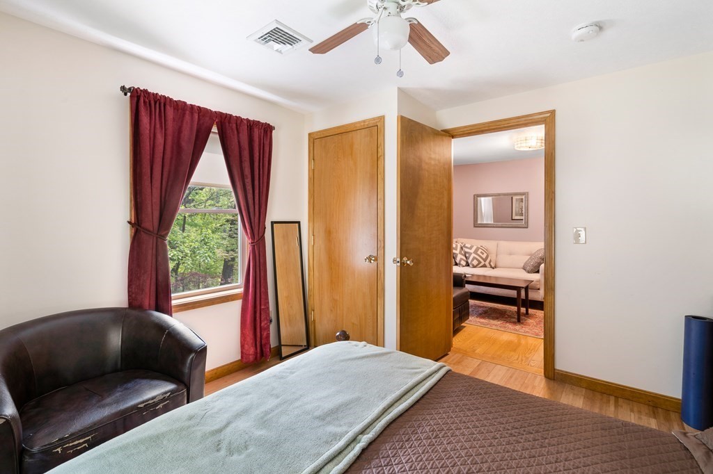32 Middle Road Southampton, MA 01073 - Photo 27 of 39 a bedroom with a bed and wooden floor