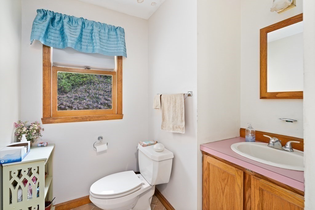 32 Middle Road Southampton, MA 01073 - Photo 31 of 39 a bathroom with a toilet a sink and a window