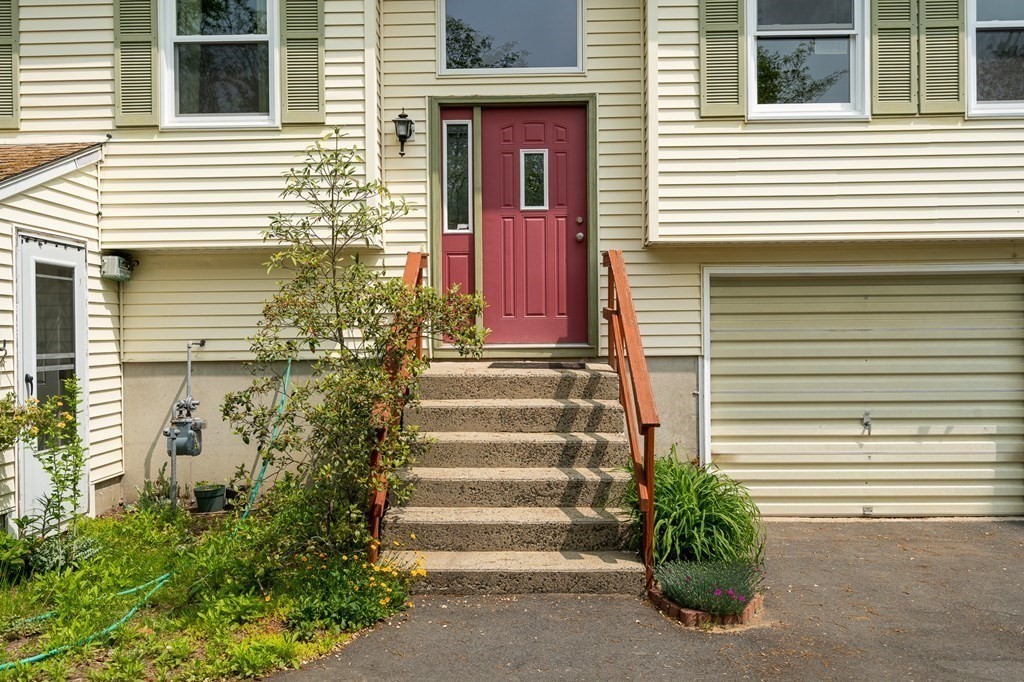 32 Middle Road Southampton, MA 01073 - Photo 4 of 39 a view of a house with potted plants and a large windows