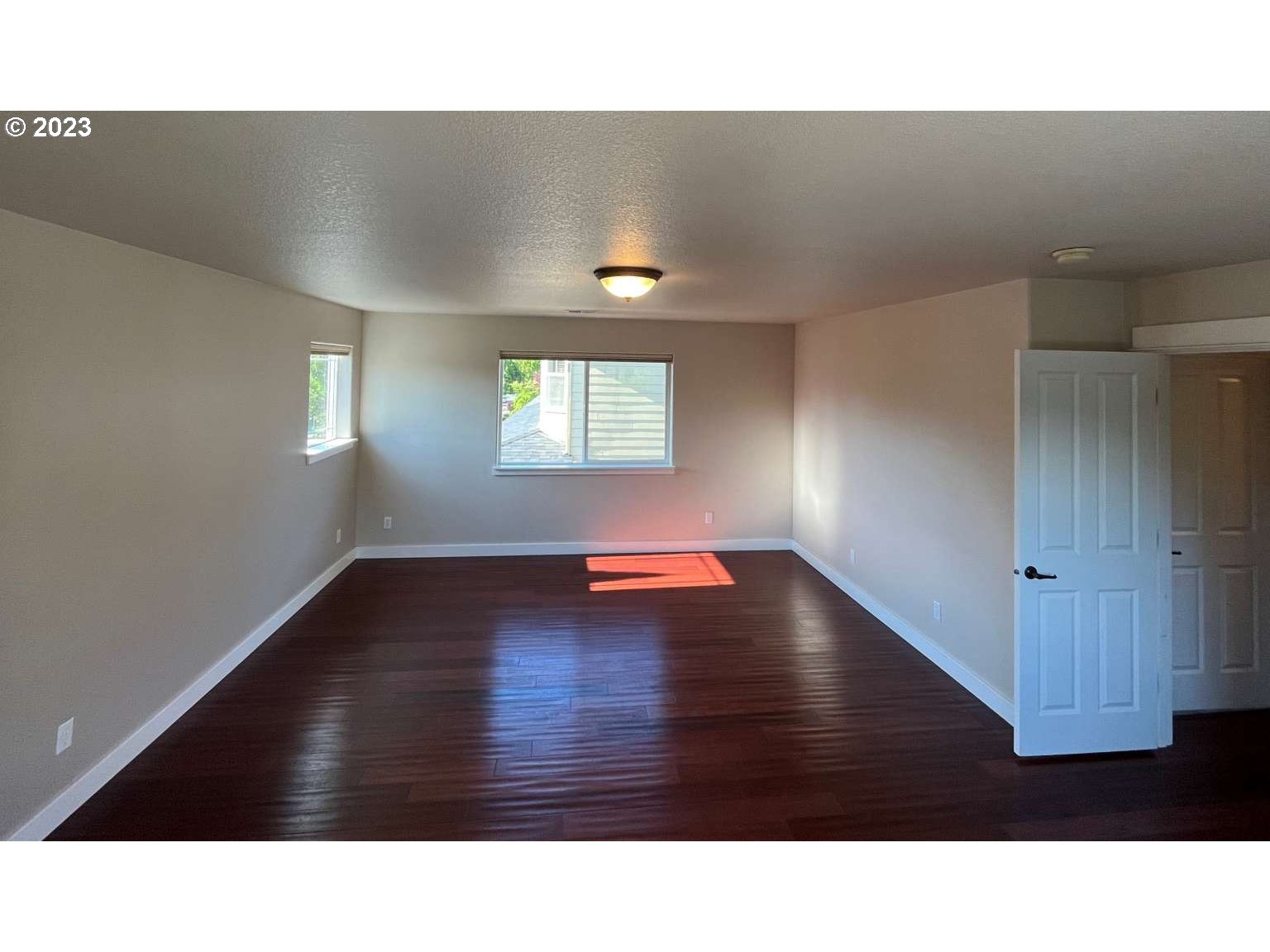 199 Northwest Camp Ireland Street Hillsboro, OR 97124 - Photo 11 of 36 a black and white photo of a living room