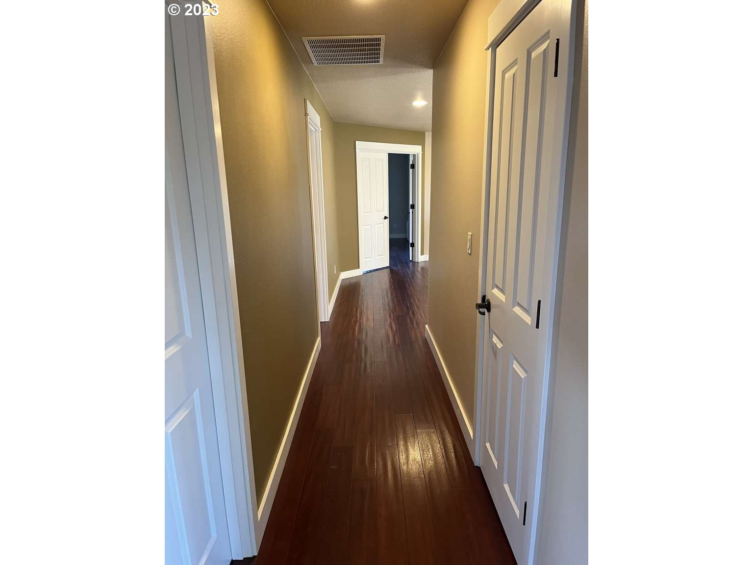 199 Northwest Camp Ireland Street Hillsboro, OR 97124 - Photo 13 of 36 a view of a hallway with wooden floor