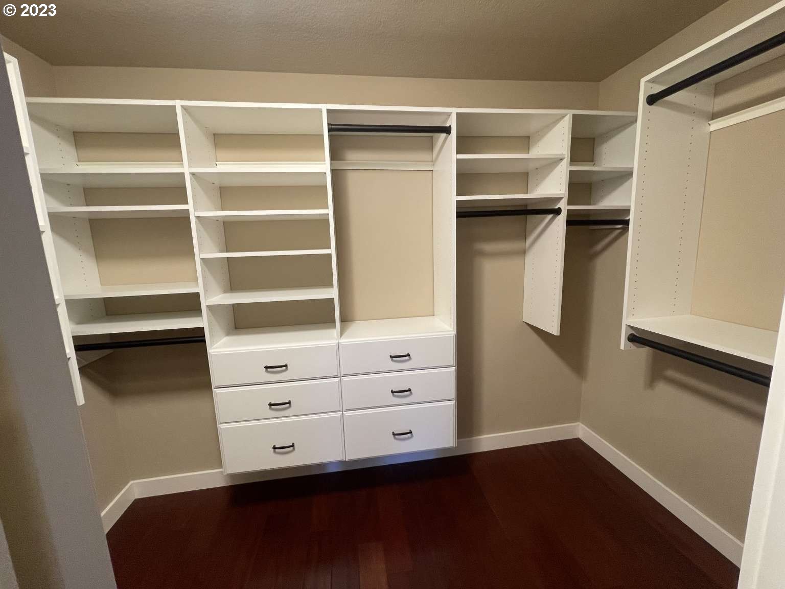 199 Northwest Camp Ireland Street Hillsboro, OR 97124 - Photo 17 of 36 a view of walk in closet with empty racks