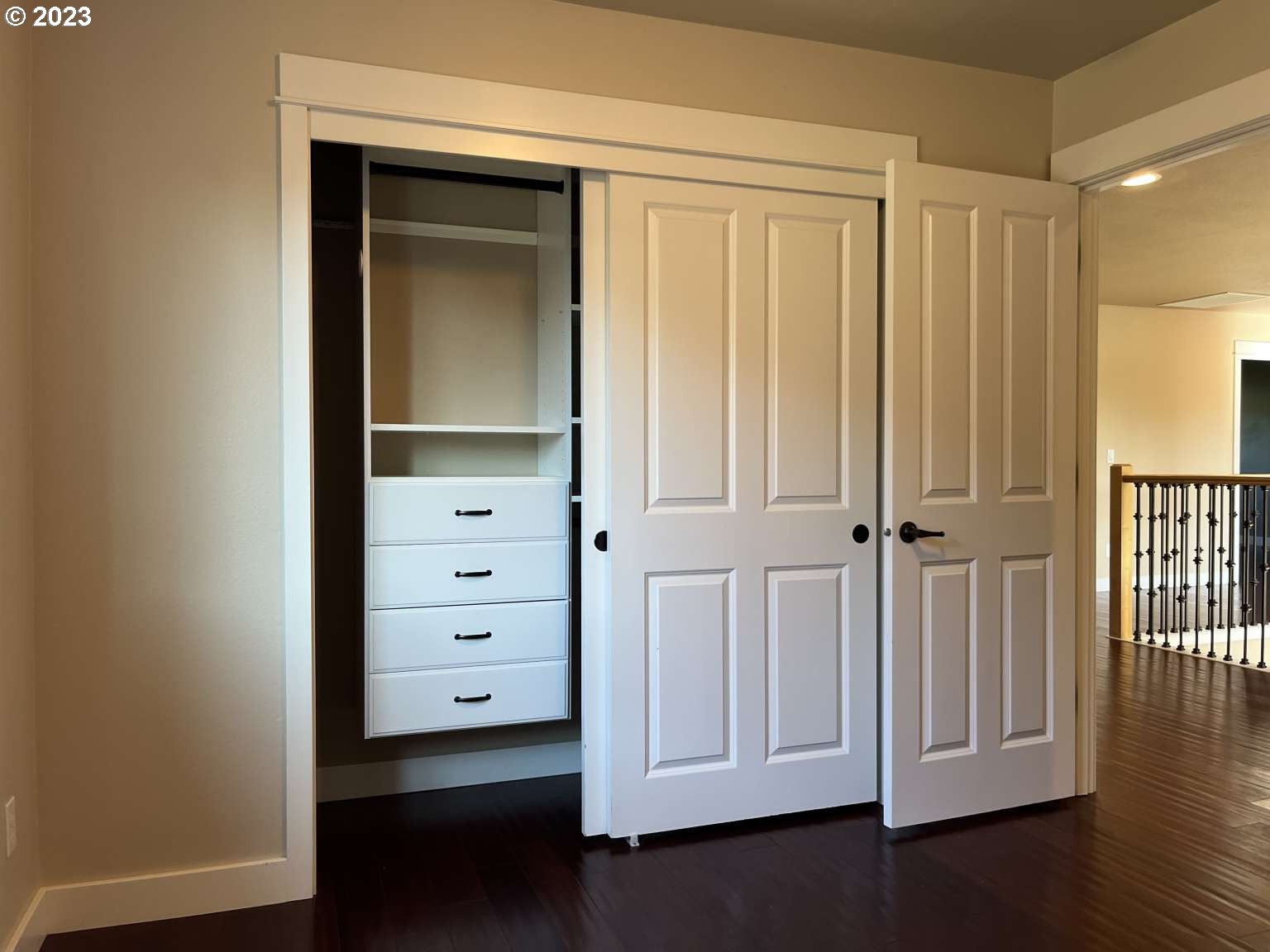 199 Northwest Camp Ireland Street Hillsboro, OR 97124 - Photo 19 of 36 an empty room with wooden floor cabinet and front door