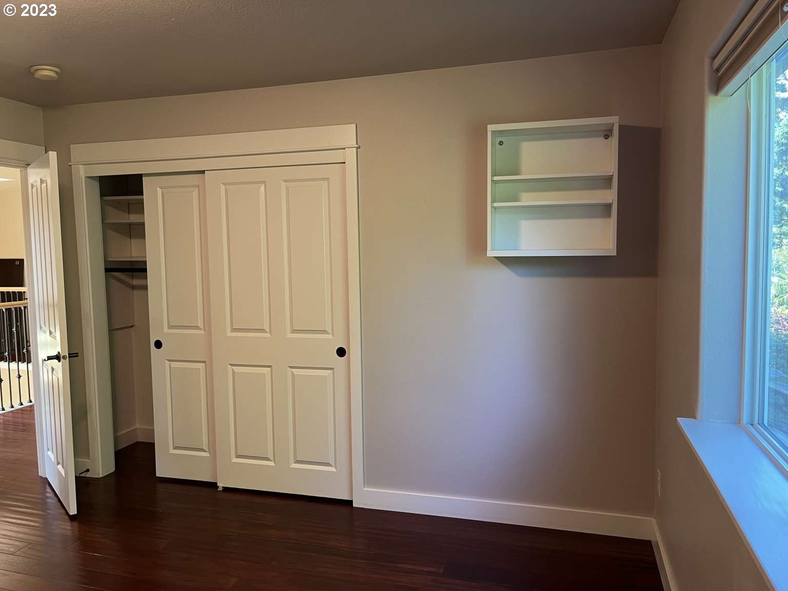 199 Northwest Camp Ireland Street Hillsboro, OR 97124 - Photo 20 of 36 an empty room with wooden floor and windows