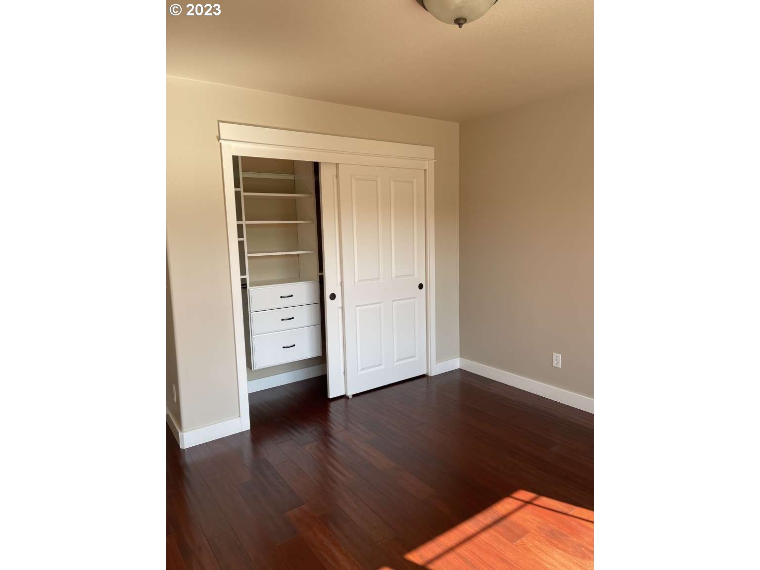 199 Northwest Camp Ireland Street Hillsboro, OR 97124 - Photo 22 of 36 a view of a hallway with wooden floor