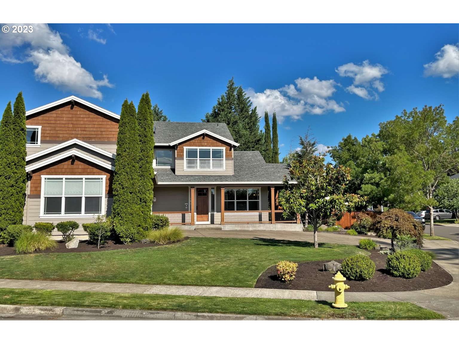 199 Northwest Camp Ireland Street Hillsboro, OR 97124 - Photo 23 of 36 a front view of a house with a yard