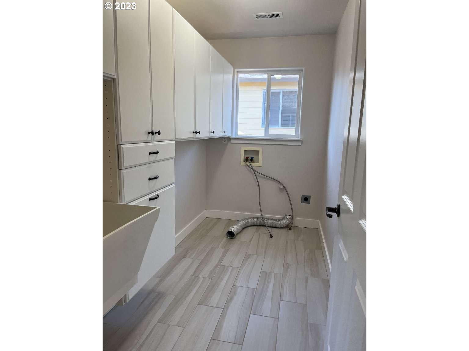 199 Northwest Camp Ireland Street Hillsboro, OR 97124 - Photo 25 of 36 a view of a hallway with wooden floor