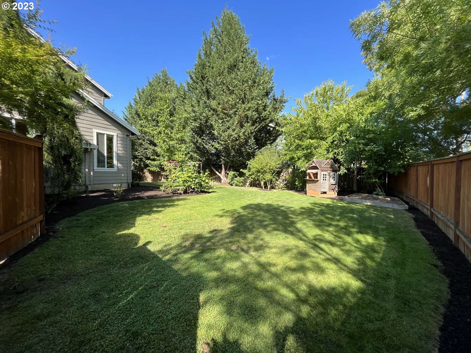 199 Northwest Camp Ireland Street Hillsboro, OR 97124 - Photo 27 of 36 a view of a house with a yard