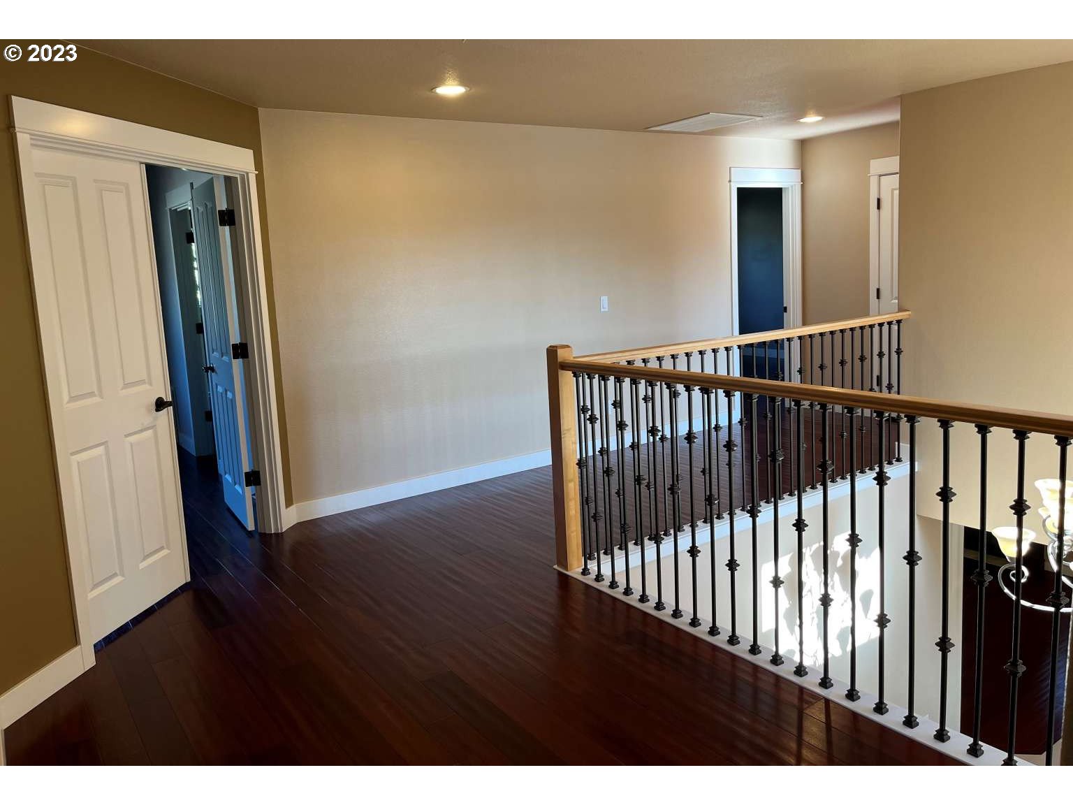 199 Northwest Camp Ireland Street Hillsboro, OR 97124 - Photo 10 of 36 a view of a hallway with wooden floor