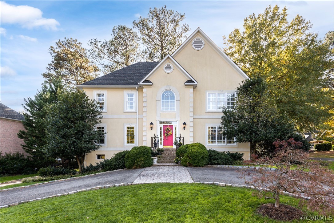 8117 Lower Ralston Road Henrico, VA 23229 - Photo 1 of 50 a front view of a house with a yard and trees