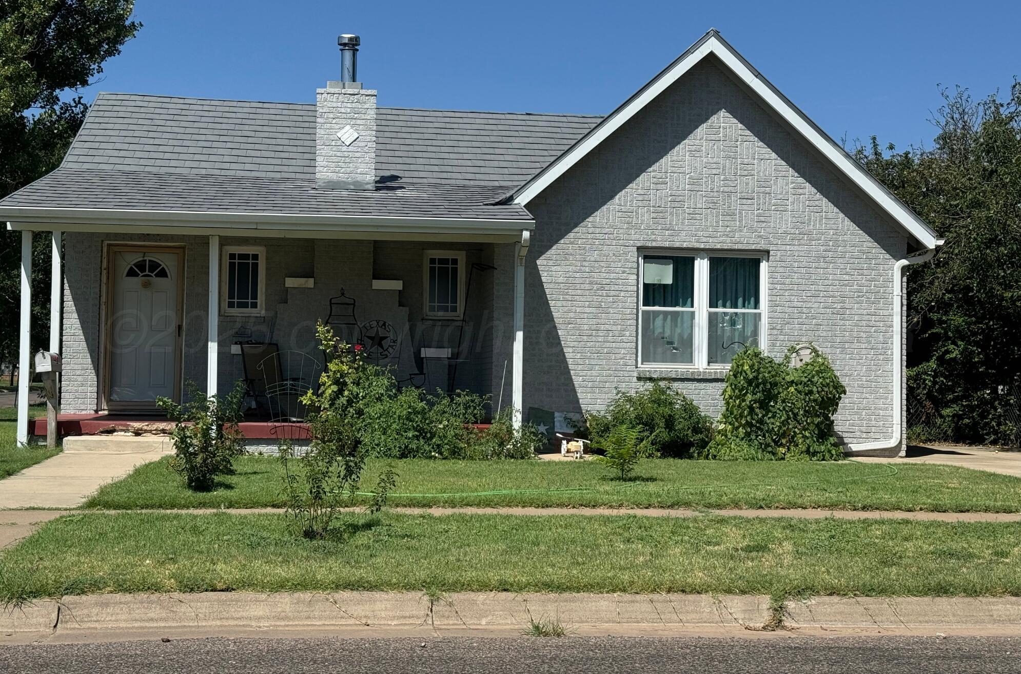 3610 South Harrison Street Amarillo, TX 79110 - Photo 8 of 8 a front view of a house with a yard