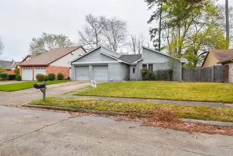 a house that has a tree in front of it