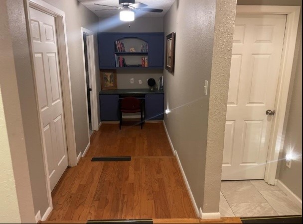 5711 Toddington Road Humble, TX 77346 - Photo 12 of 35 a view of a hallway with wooden floor and entryway