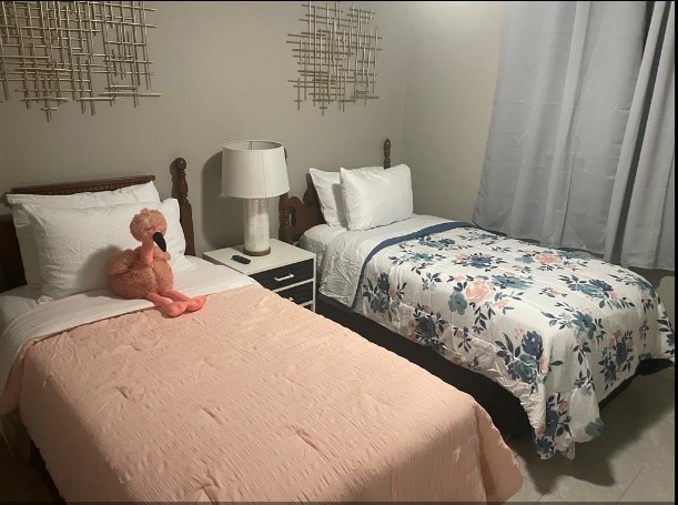 5711 Toddington Road Humble, TX 77346 - Photo 16 of 35 a bedroom with a bed and wooden floor