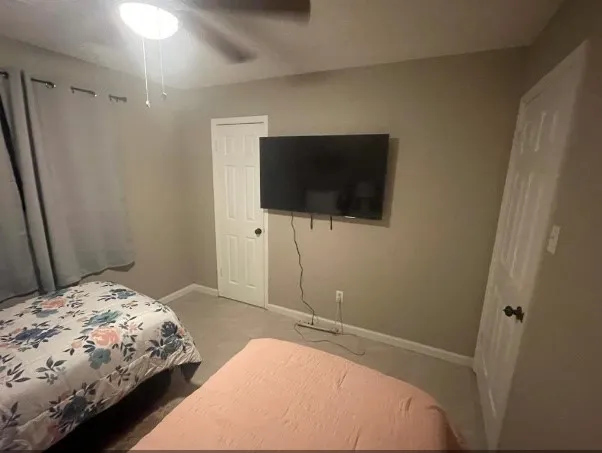 a bedroom with a bed and a toilet