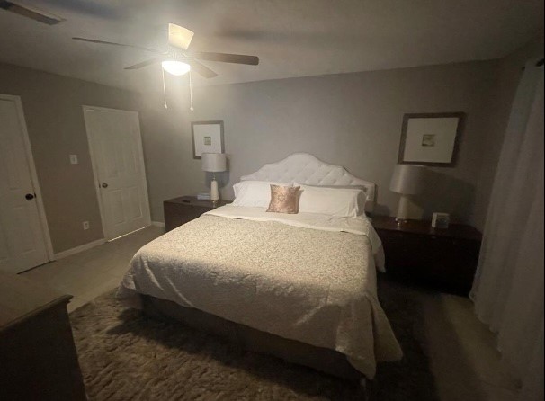 5711 Toddington Road Humble, TX 77346 - Photo 20 of 35 a bedroom with a bed and mirror