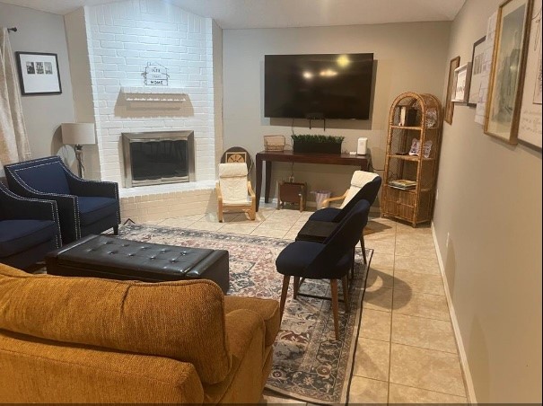 5711 Toddington Road Humble, TX 77346 - Photo 2 of 35 a living room with furniture and a flat screen tv
