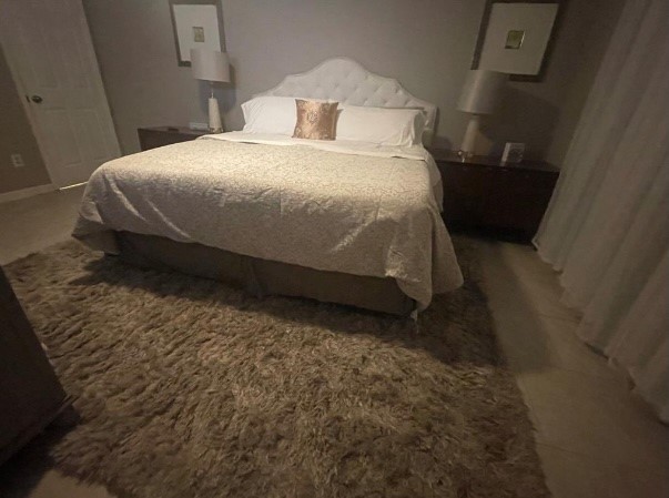 5711 Toddington Road Humble, TX 77346 - Photo 21 of 35 a bedroom with a bed and a toilet