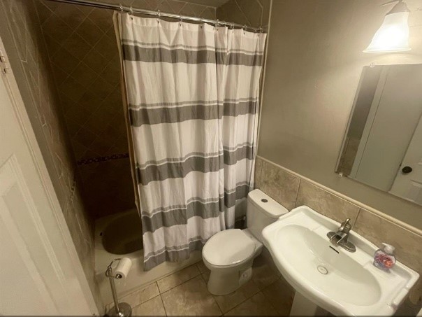 5711 Toddington Road Humble, TX 77346 - Photo 29 of 35 a bathroom with a sink and toilet