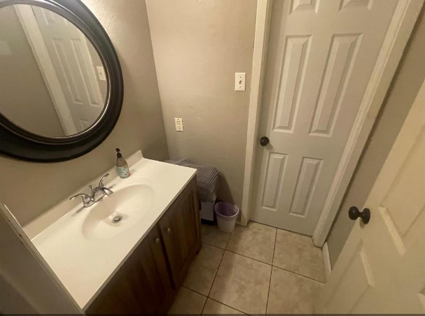 5711 Toddington Road Humble, TX 77346 - Photo 31 of 35 a bathroom with a sink and a mirror