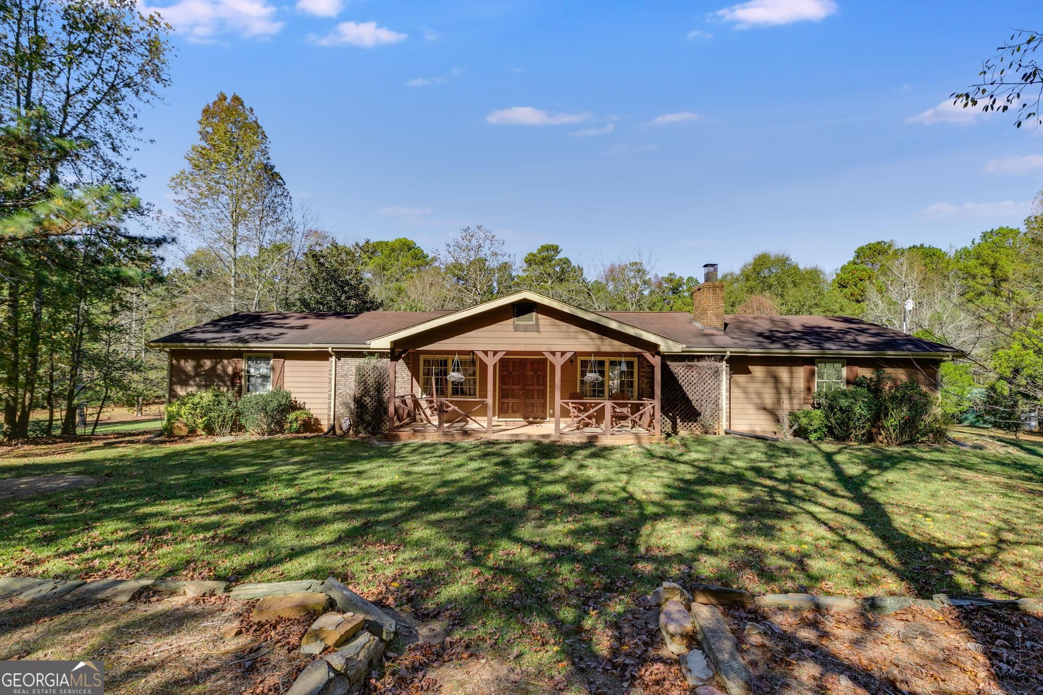 243 Frost Street Roopville, GA 30170 - Photo 1 of 1 a big house with a big yard and large trees