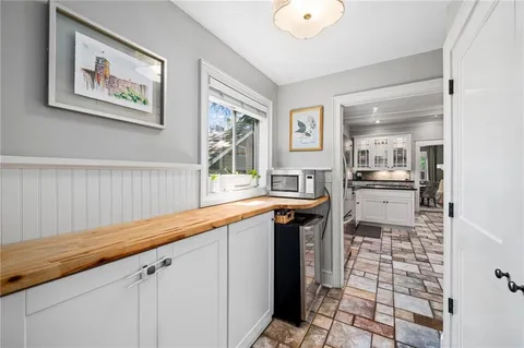 a kitchen with granite countertop a sink and a counter top space