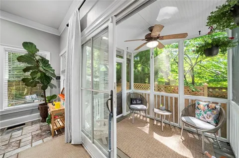 a dining room with furniture water view and a potted plant