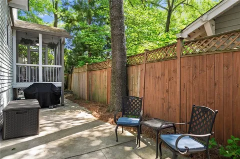 a view of a backyard with furniture
