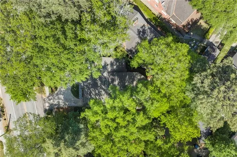 a backyard of a house with a yard and outdoor seating