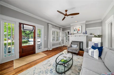 a living room with furniture and a fireplace