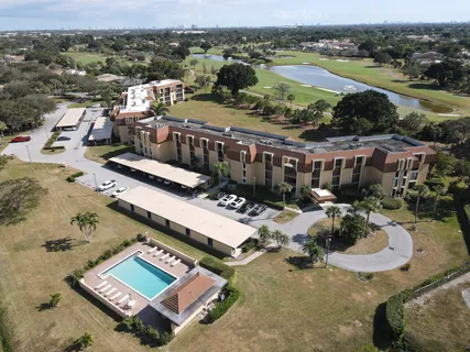 an aerial view of a house with a big yard