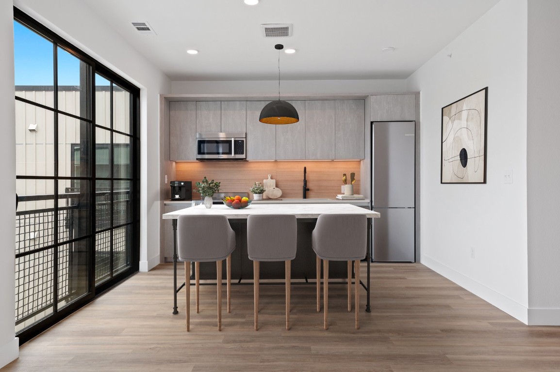 4315 South Congress Avenue, Unit 424 Austin, TX 78745 - Photo 3 of 12 a dining room with furniture and window