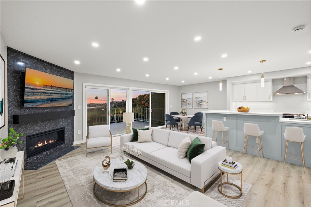 25836 Dana Bluff West, Unit 32 Dana Point, CA 92624 - Photo 1 of 47 a living room with furniture and a fireplace