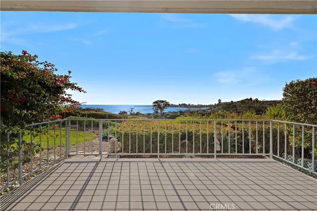 a view of a balcony with lake view and mountain view