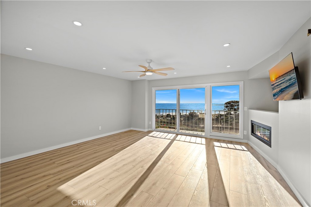 25836 Dana Bluff West, Unit 32 Dana Point, CA 92624 - Photo 17 of 47 a view of a kitchen with a sink and wooden floor