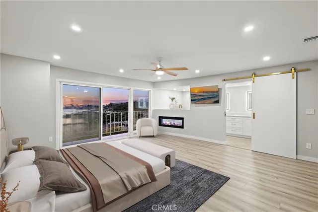 a spacious bedroom with a large bed and a large window