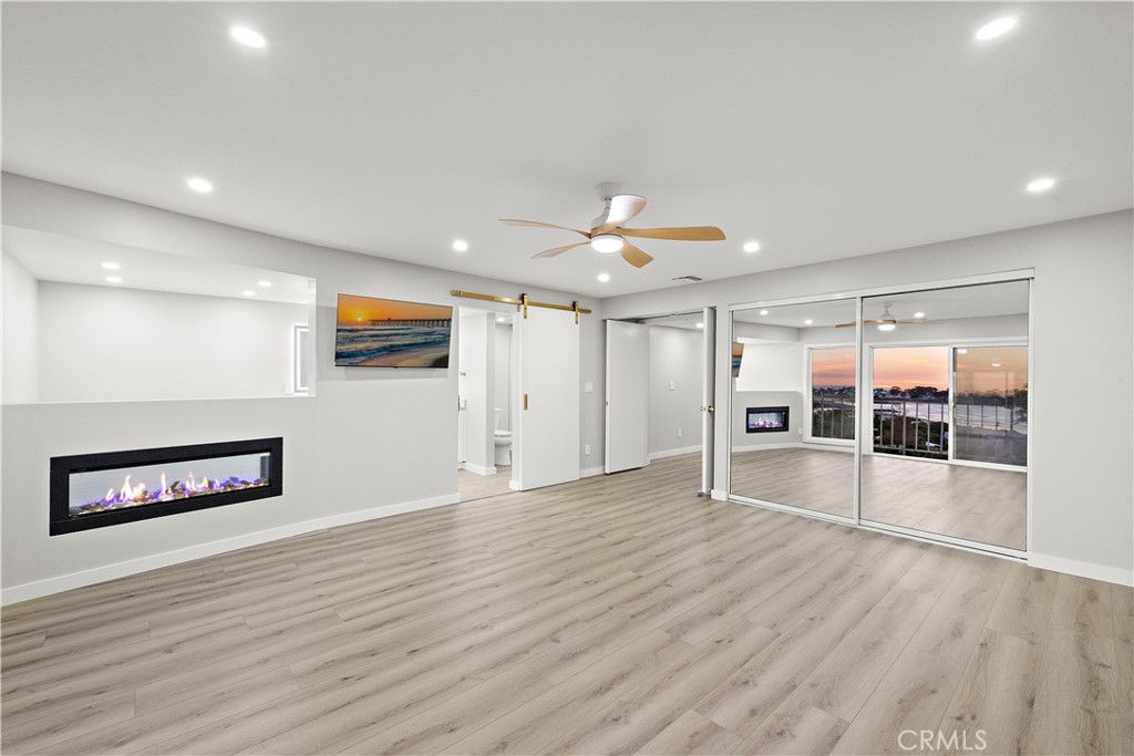 25836 Dana Bluff West, Unit 32 Dana Point, CA 92624 - Photo 20 of 47 a view of empty room with wooden floor