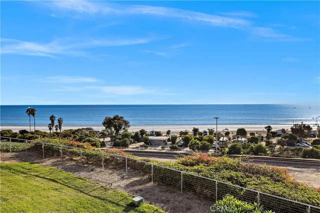 a living room with furniture and a book shelf