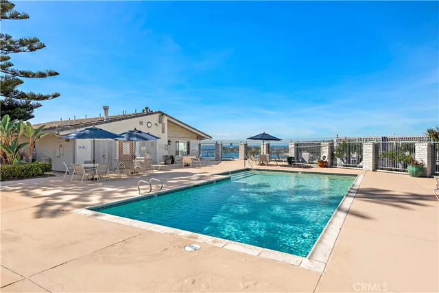 a view of a swimming pool with a patio