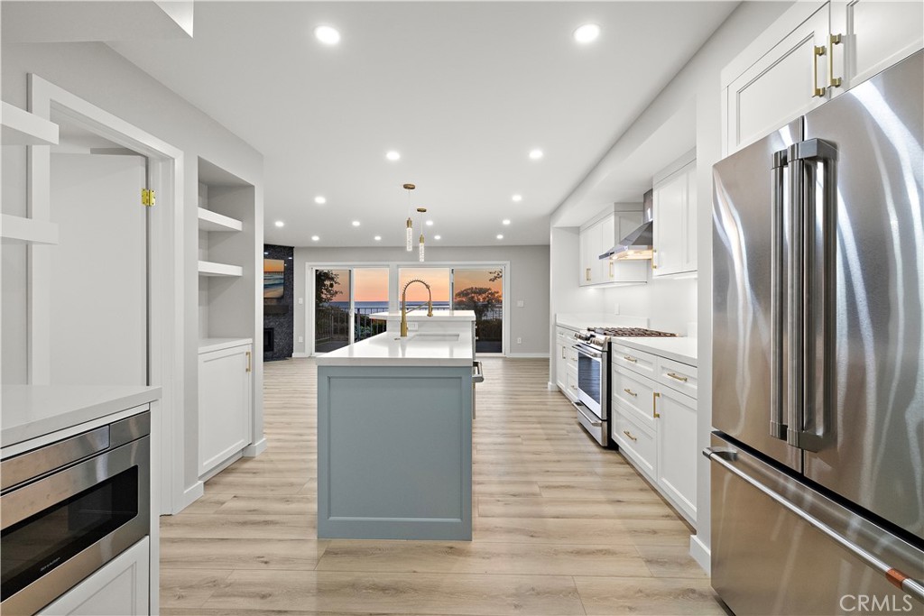 25836 Dana Bluff West, Unit 32 Dana Point, CA 92624 - Photo 6 of 47 a kitchen with refrigerator and microwave