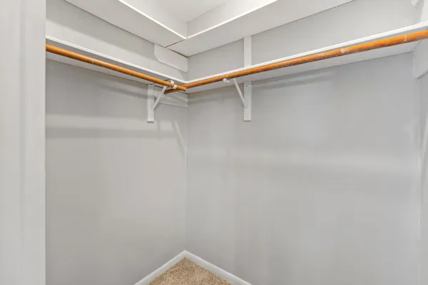 a view of an empty walk in closet