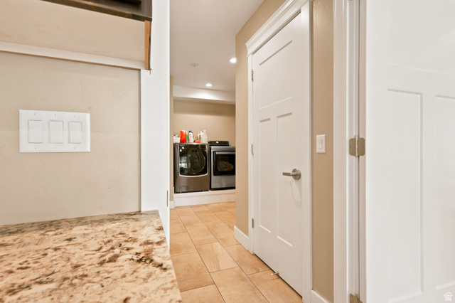 580 North 300 East Logan, UT 84321 - Photo 35 of 74 Dedicated laundry area featuring tile flooring, neutral wall tones, modern doors with brushed nickel hardware, and recessed lighting