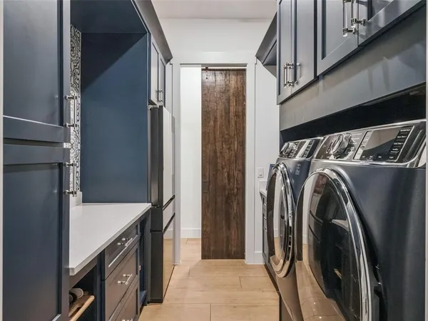 a kitchen with a sink cabinets and appliances