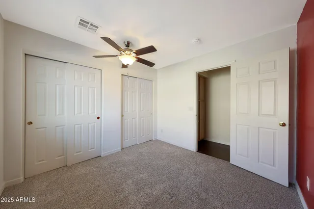 a kitchen with stainless steel appliances kitchen island a refrigerator sink and cabinets