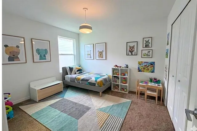 a bedroom with a bed and a couch