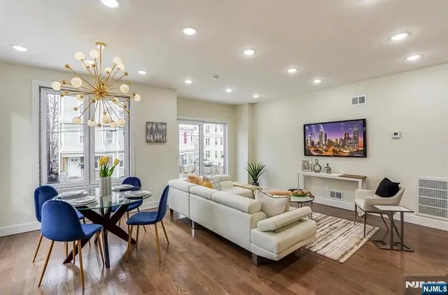 a living room with furniture and a large window
