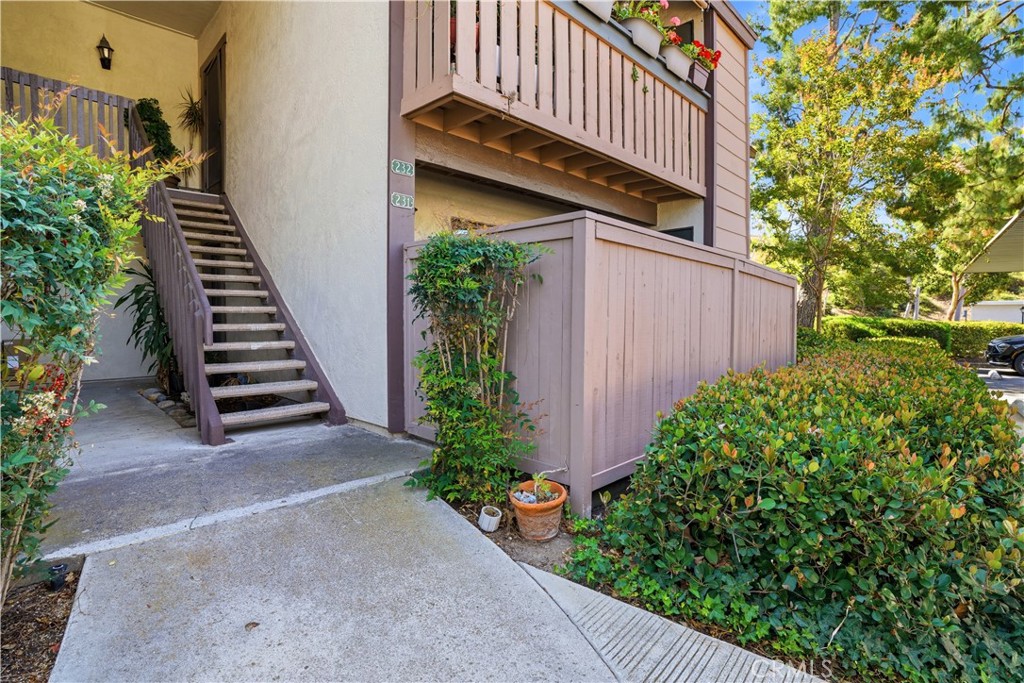 20702 El Toro Road, Unit 231 Lake Forest, CA 92630 - Photo 29 of 36 a view of a house with a yard plants and flower plants