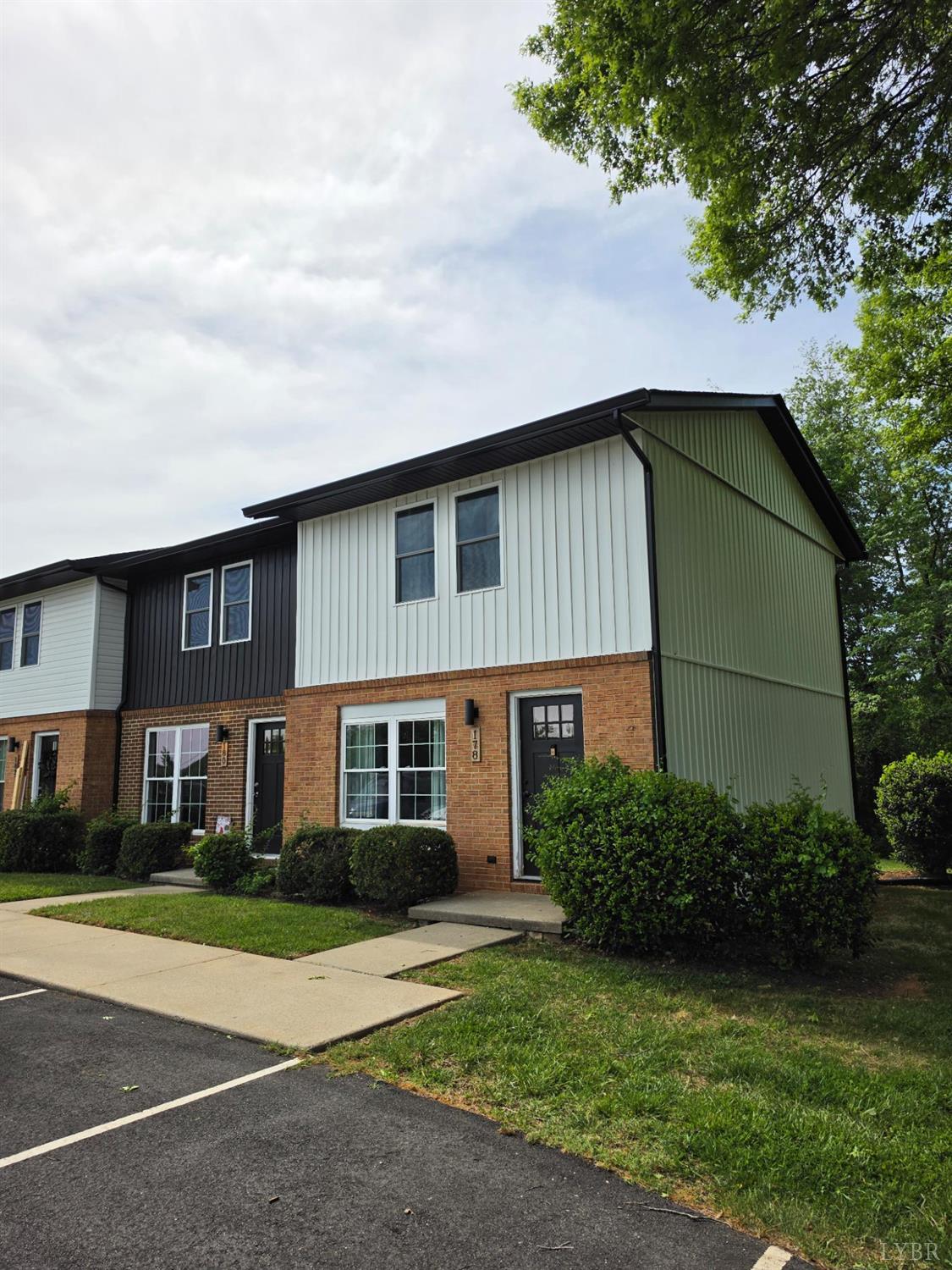 178 Dulwich Drive, Unit 178 Amherst, VA 24521 - Photo 1 of 17 a front view of a house with a garden